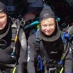 two people in diving gear