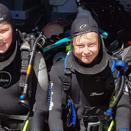 two people in diving gear