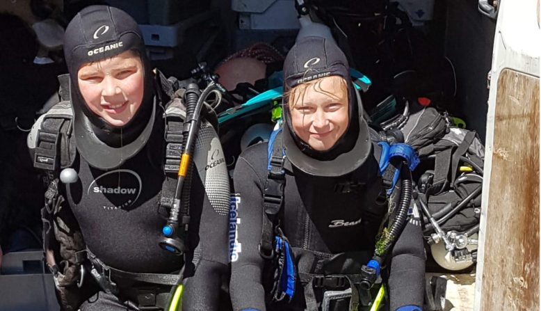 two people in diving gear