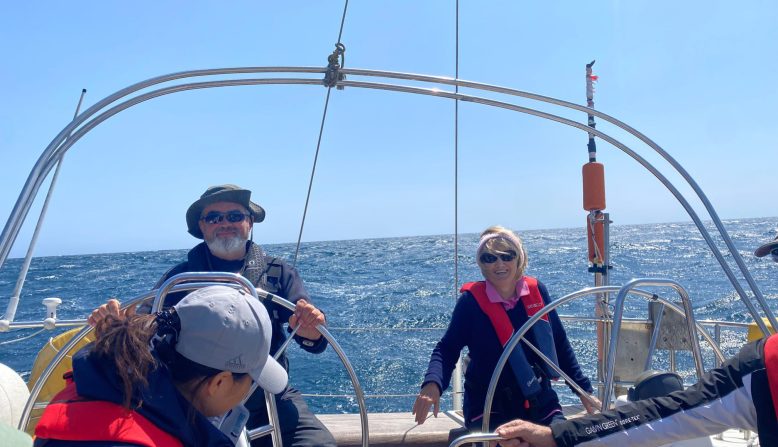 a man and a woman riding a boat