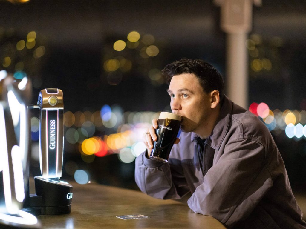 A man drinking a pint of Gunnies 