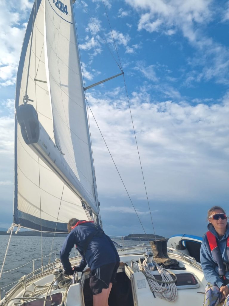 Two men on a sailing boat